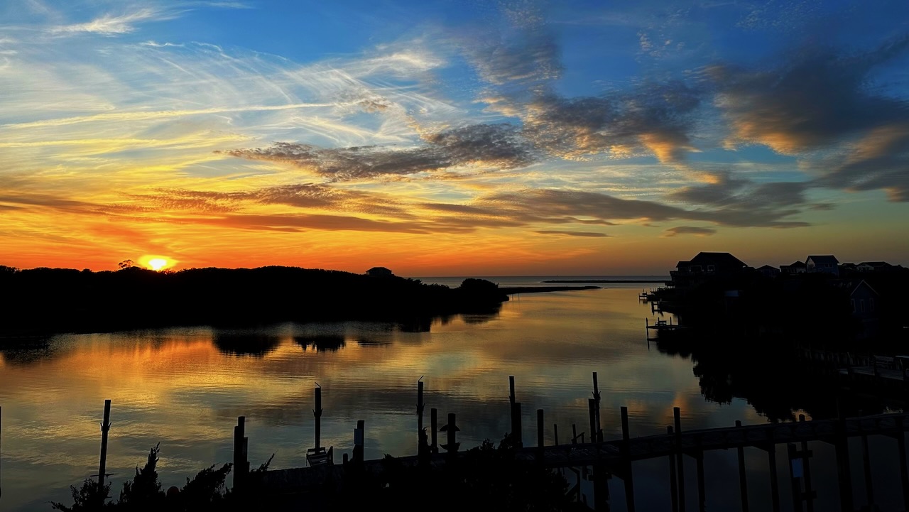 Sunset over inlet and sound.