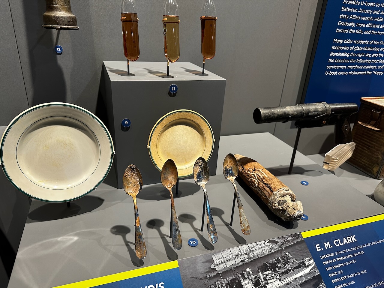 Artifacts from shipwrecks, including flatware, plates, and other equipment.