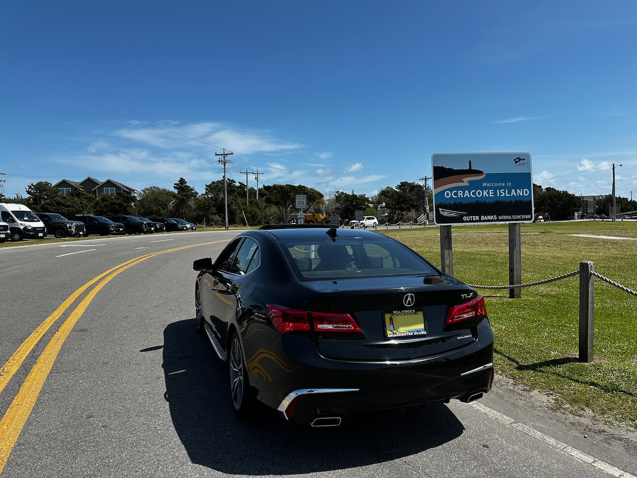 2020 Acura TLX parked by "Welcome to Ocracoke" sign.
