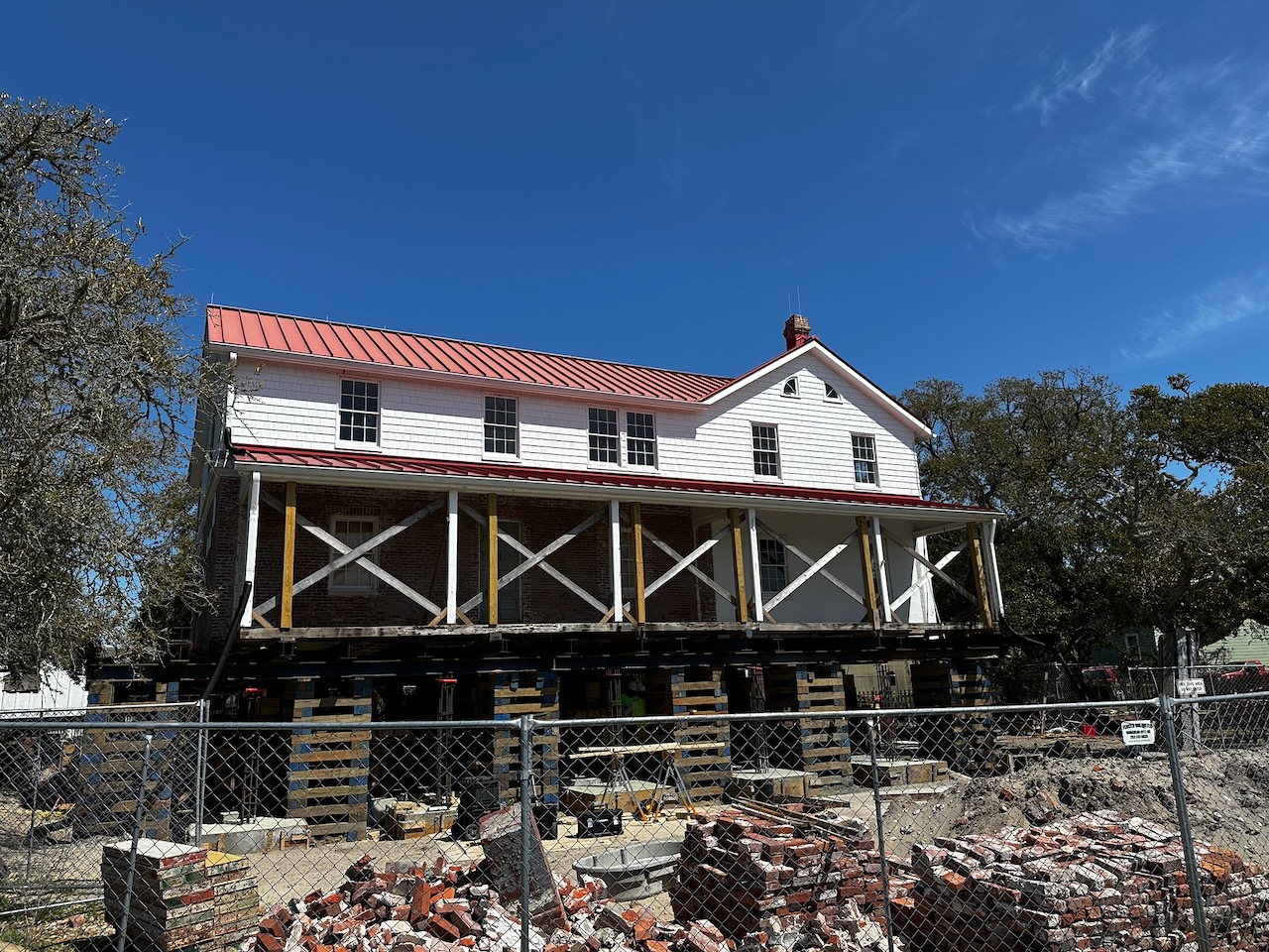 Lighthouse keeper's house, on brick stilts during renovation.