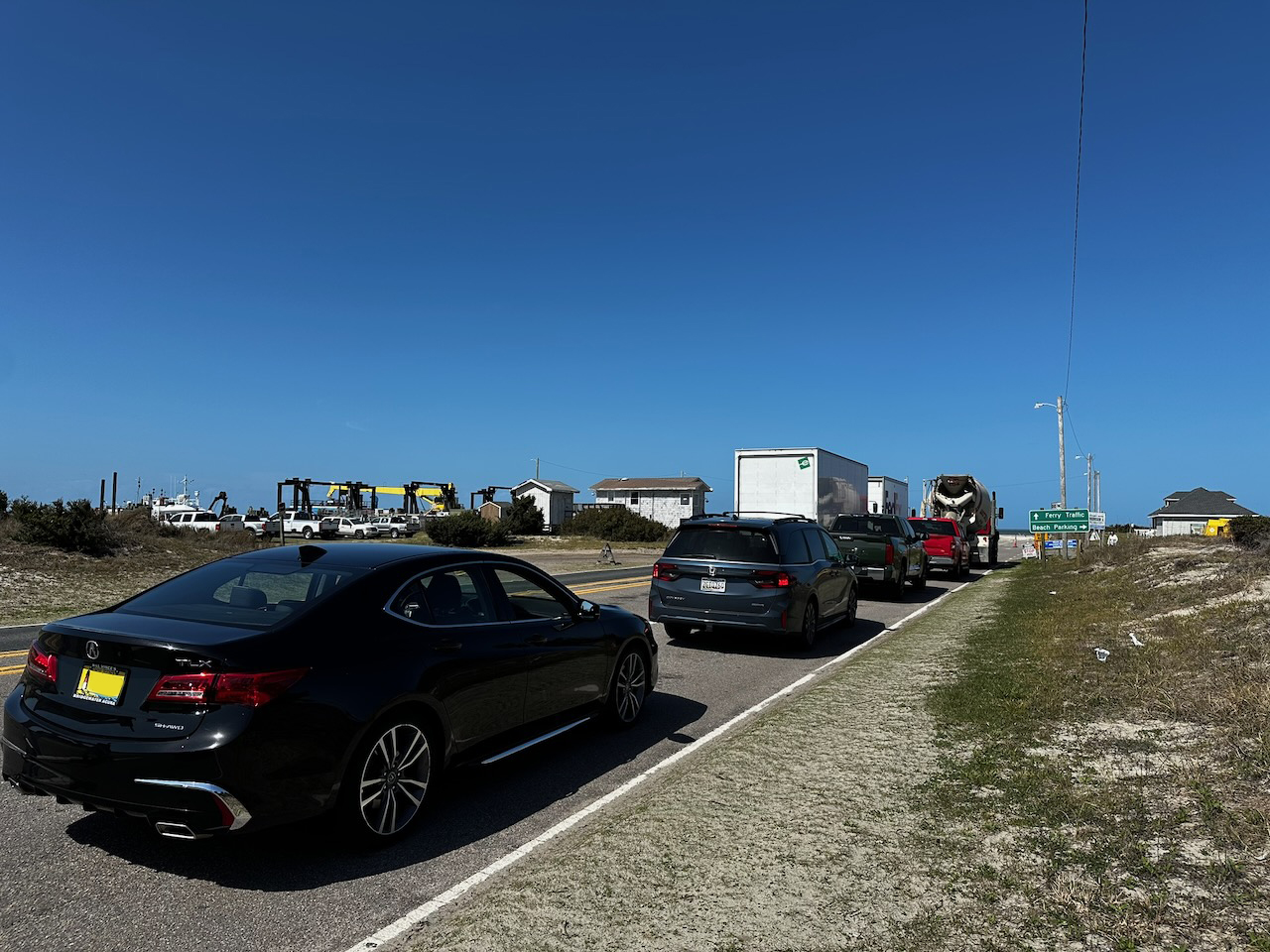 2020 Acura TLX lined up behind vehicles. 