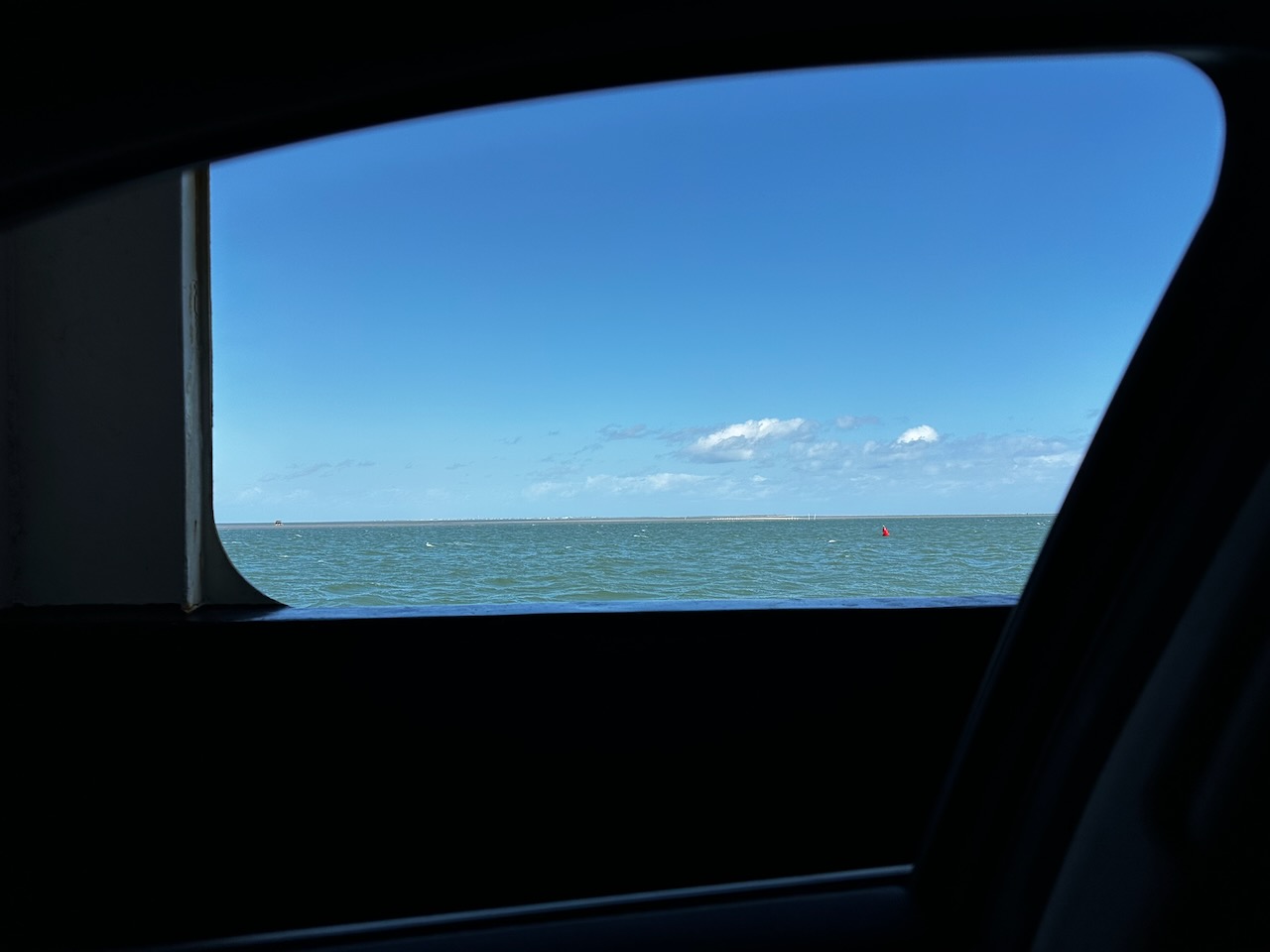 View of Pamlico Sound through car window.