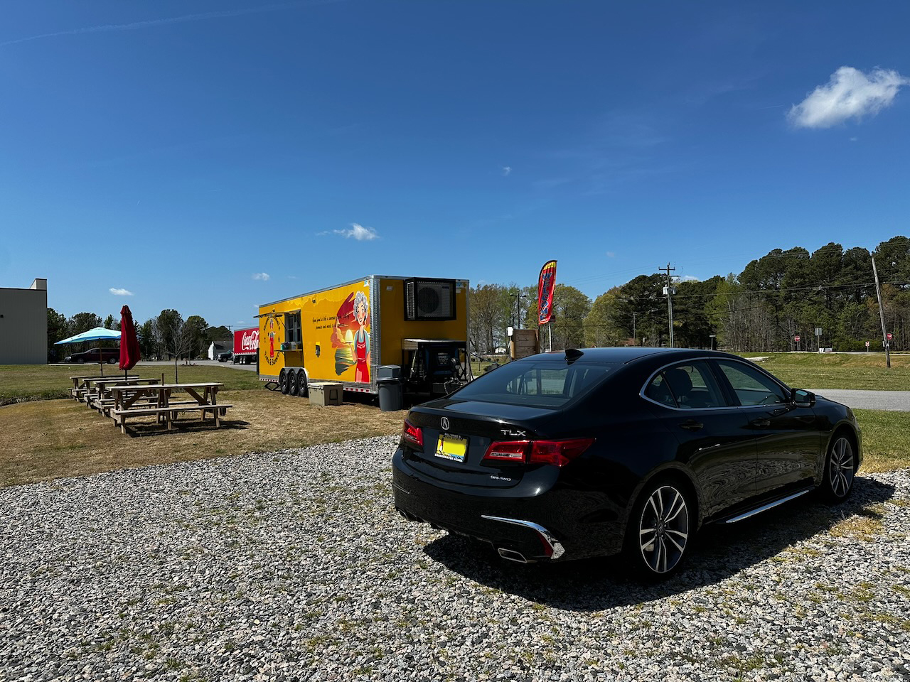 2020 Acura TLX parked near food truck.