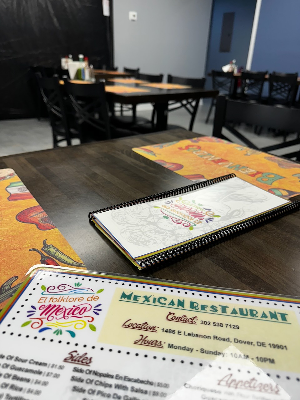 Menu of Mexican restaurant on table.