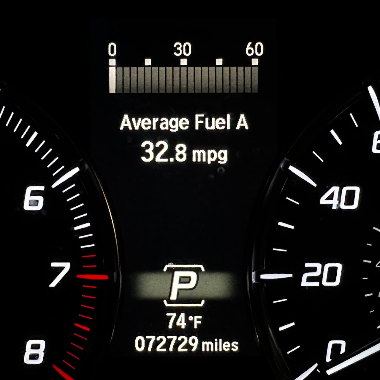 View of car odometer reading 72729 miles.