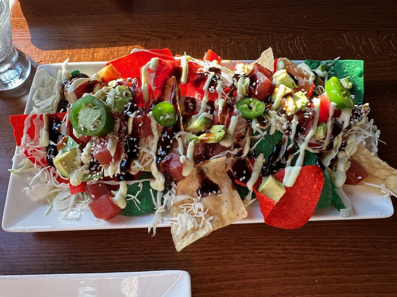 Order of tuna nachos on white plate.