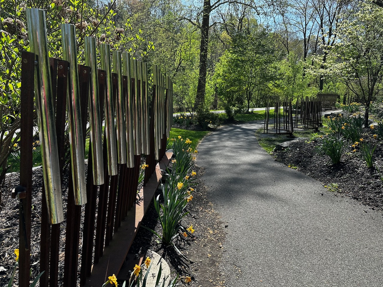 Musical Path, featuring large metal chimes on both sides of path.