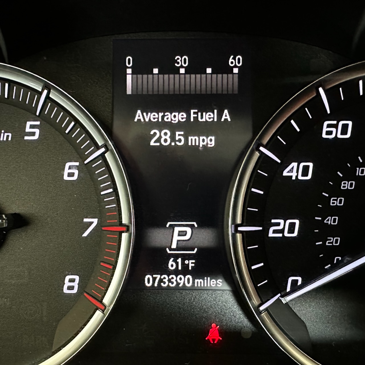 Car odometer reading 73390 miles.